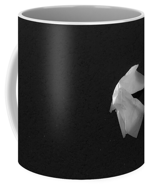 Absorbing Coffee Mug featuring the photograph Discarded Paper Soaking into Pool of Water by John Williams