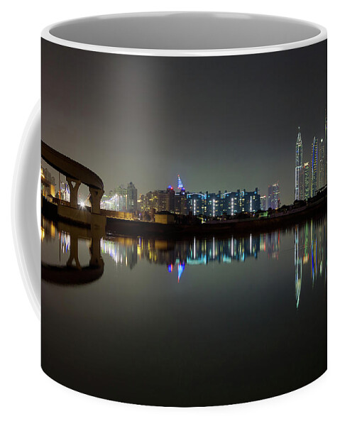 Dubai Coffee Mug featuring the photograph Dubai city skyline night time reflection by Andy Myatt