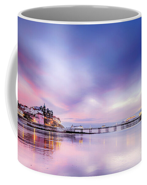 Cromer Coffee Mug featuring the photograph Famous Cromer pier in Norfolk England with pink sunset by Simon Bratt