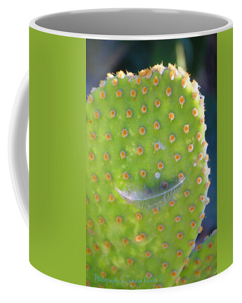 Arizona Coffee Mug featuring the photograph Feather on Cactus 2 by Tamara Kulish