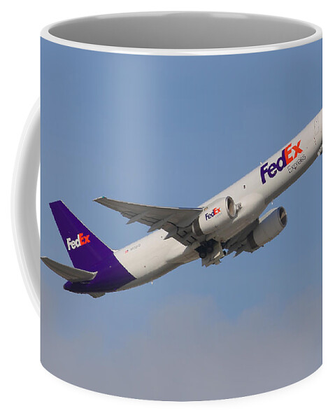 Airplane Coffee Mug featuring the photograph FedEx Jet by Dart Humeston