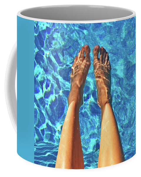 Foot Coffee Mug featuring the photograph Female feet in blue water by GoodMood Art