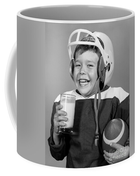 1960s Coffee Mug featuring the photograph Football And Milk, C.1960s by H. Armstrong Roberts/ClassicStock