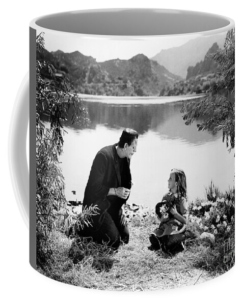 Frankenstein Coffee Mug featuring the photograph Frankenstein by the lake with little girl Boris Karloff by Vintage Collectables