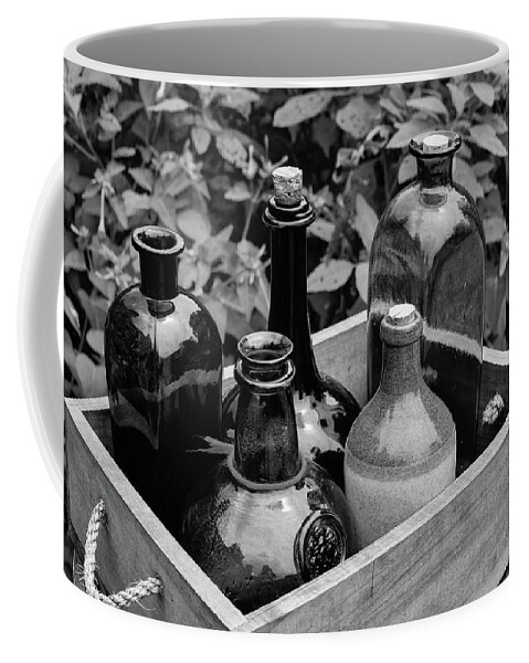 Antique Coffee Mug featuring the photograph Glass Bottles in the Garden by Nicole Lloyd