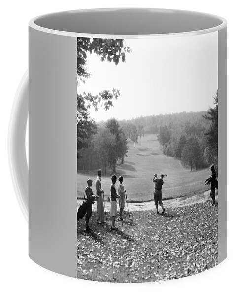 1920s Coffee Mug featuring the photograph Group Of Golfers Teeing Off, C.1920-30s by H. Armstrong Roberts/ClassicStock