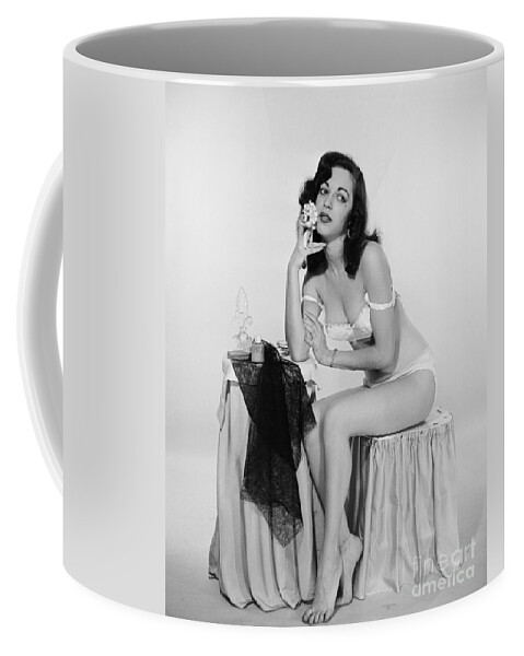 1950s Coffee Mug featuring the photograph Half-dressed Woman At Dressing Table by H. Armstrong Roberts/ClassicStock