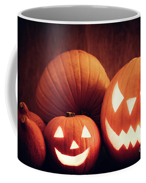 Halloween Coffee Mug featuring the photograph Halloween pumpkins glowing, jack-o-lantern by Michal Bednarek