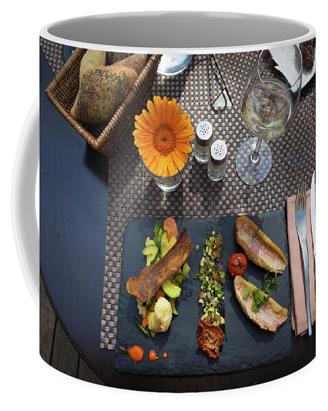 Fork Coffee Mug featuring the photograph Health fish dish served at a French restaurant by Semmick Photo