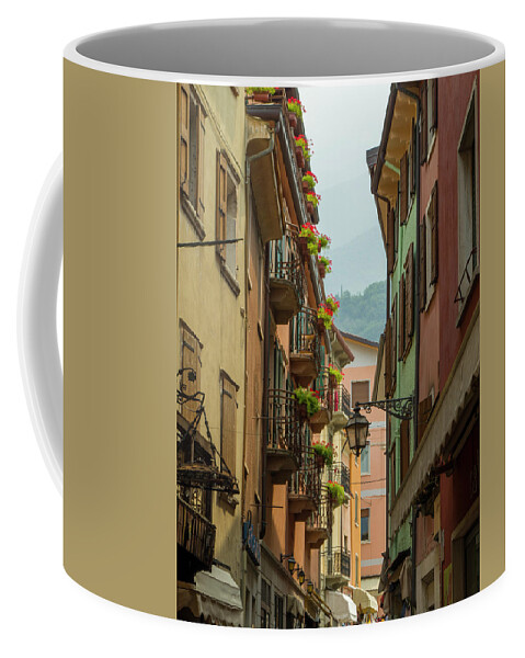 Alley Coffee Mug featuring the photograph Historical street in Malcesine village, lake Garda, Italy by Nicola Aristolao