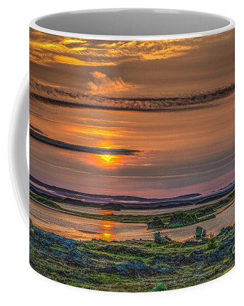 Iceland Coffee Mug featuring the photograph Icelandic sunset by Izet Kapetanovic