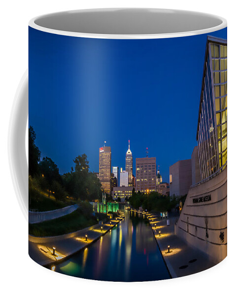 Art Coffee Mug featuring the photograph Indianapolis Skyline from the Canal at Night by Ron Pate