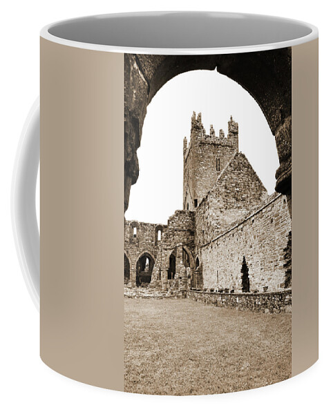 Jerpoint Coffee Mug featuring the photograph Jerpoint Abbey Church Tower Under Cloister Arch County Kilkenny Ireland Sepia by Shawn O'Brien