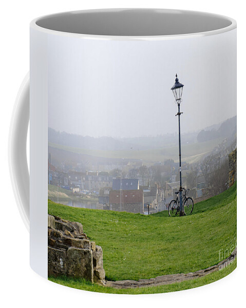 Lamppost Coffee Mug featuring the photograph Lamppost and bike. by Elena Perelman