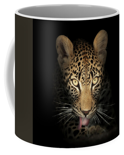 Leopardeyesdarkblackbackgroundwildlifeanimalmammalwildcatpantherapardusspottedfierceintensestarelookpowerfulpredatorcloseupclose-upclosepiercinglicktonguefrontviewafricaphotographonenobodyportraitsafaripawyellownaturedetail015092rs2 Coffee Mug featuring the photograph Leopard In The Dark by Johan Swanepoel