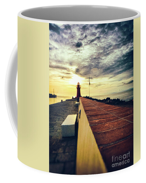 Architecture Coffee Mug featuring the photograph Lighthouse at sunset by Silvia Ganora