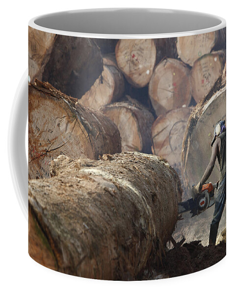 Mp Coffee Mug featuring the photograph Logger Cutting Tree Trunk, Cameroon by Cyril Ruoso