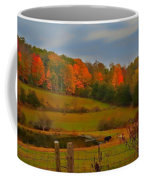 Autumn Coffee Mug featuring the photograph Lucky Cow by Dani McEvoy