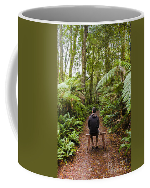 Tasmania Coffee Mug featuring the photograph Man relaxing in Strahan rainforest retreat by Jorgo Photography