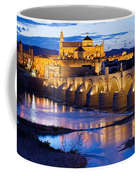 Cordoba Coffee Mug featuring the photograph Cathedral Mosque and Roman Bridge in Cordoba #1 by Artur Bogacki