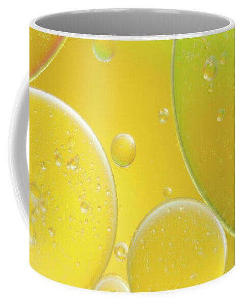 Water Coffee Mug featuring the photograph Oil and water bubbles by Andy Myatt