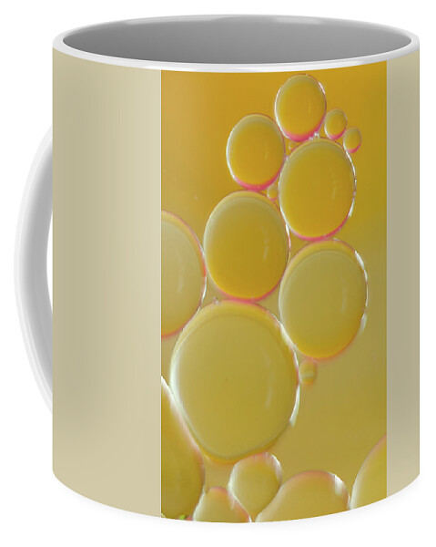 Water Coffee Mug featuring the photograph Oil bubbles on water abstract by Andy Myatt