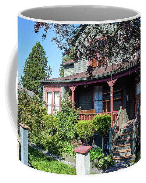 La Conner Coffee Mug featuring the photograph Pink and Green House by Tom Cochran