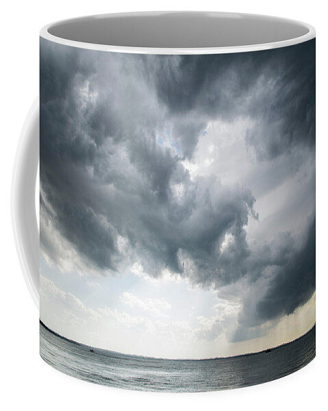 Storm Coffee Mug featuring the photograph Powerful storm approaching, by Nicola Aristolao