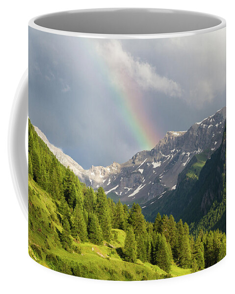 Mountain Landscape Coffee Mug featuring the photograph Rainbow over the mountains by Paul MAURICE