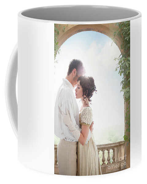 Regency Coffee Mug featuring the photograph Regency Couple Embracing Beneath An Archway by Lee Avison