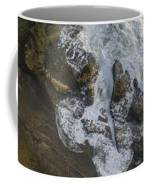 Above Coffee Mug featuring the photograph Relentless by David Levy