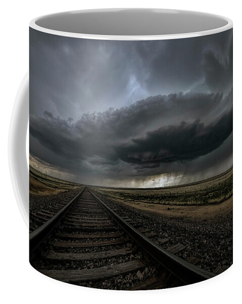 Storm Coffee Mug featuring the photograph Right on track by Jeff Niederstadt