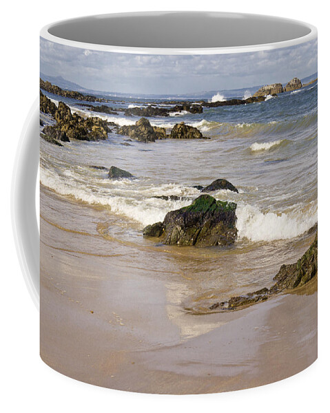 Rocks Coffee Mug featuring the photograph Rocks, waves, sand and sky reflection. by Elena Perelman
