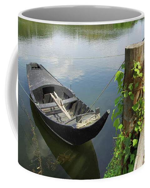 Boat Coffee Mug featuring the photograph Row Boat on the shoreline by Carlos Caetano