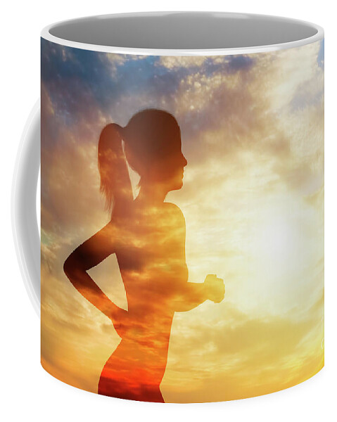 Woman Coffee Mug featuring the photograph Silhouette of a running woman on sky background. by Michal Bednarek