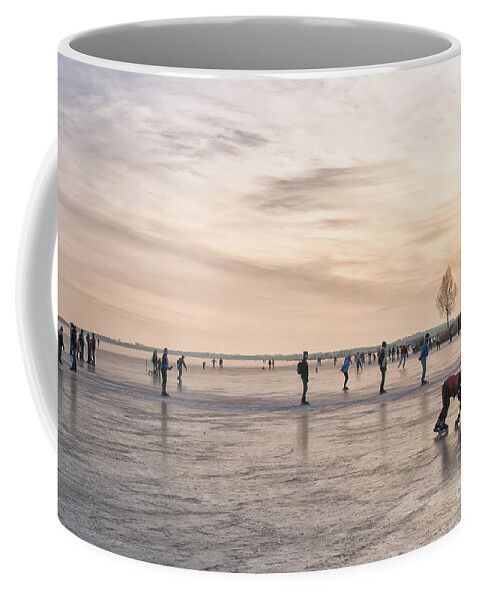 Winter Coffee Mug featuring the photograph Skating at sunset by Patricia Hofmeester