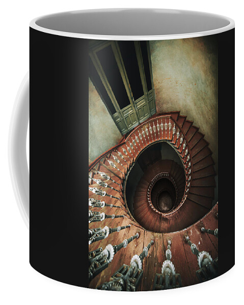 Spiral Coffee Mug featuring the photograph Spiral staircase in red and brown tones by Jaroslaw Blaminsky