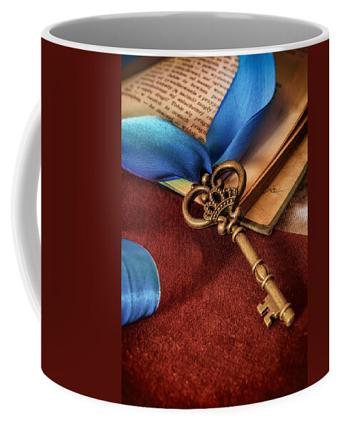 Ribbon Coffee Mug featuring the photograph Still life with brass ornamented key and blue ribbon by Jaroslaw Blaminsky
