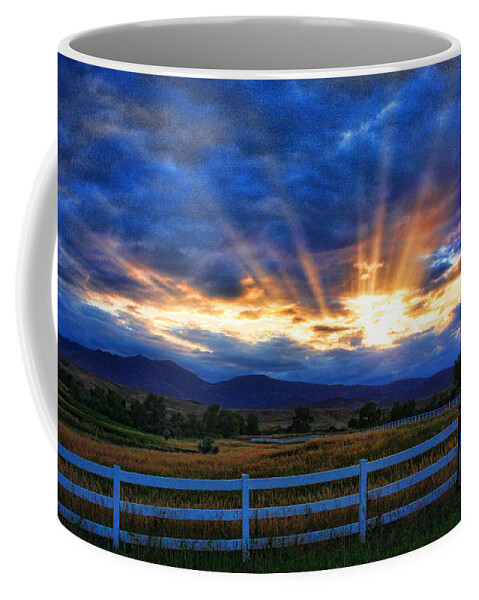 Sunset Coffee Mug featuring the photograph Sun beams in the sky at sunset by James BO Insogna