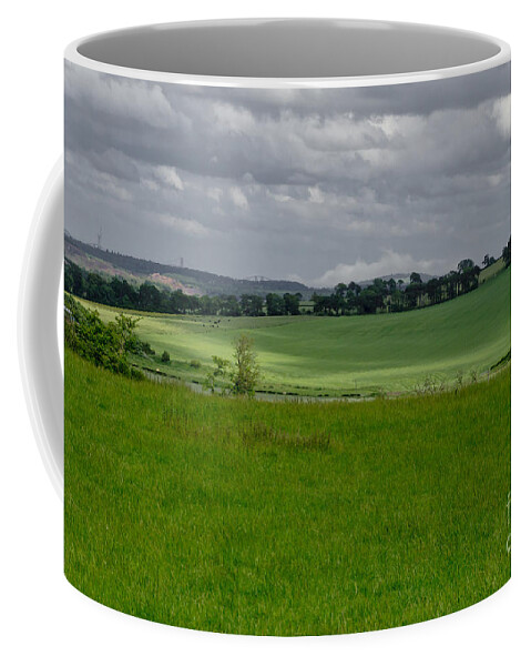 Beecraigs Coffee Mug featuring the photograph Sunny patches on the field. by Elena Perelman