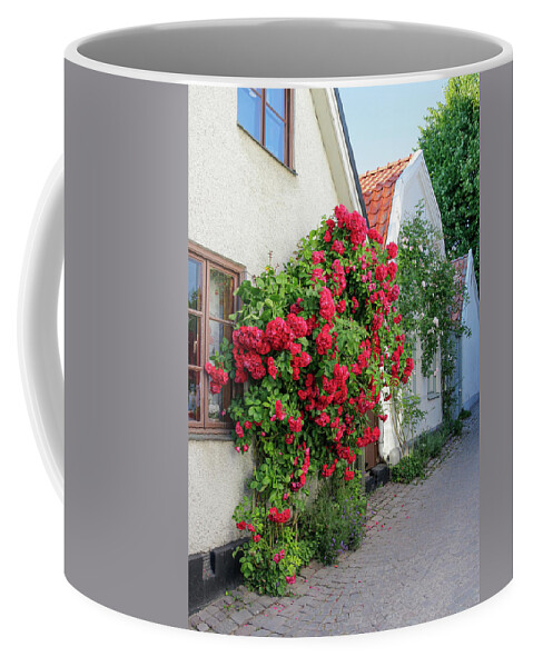 Roses Coffee Mug featuring the photograph Swedish town Visby, famous for its roses by GoodMood Art