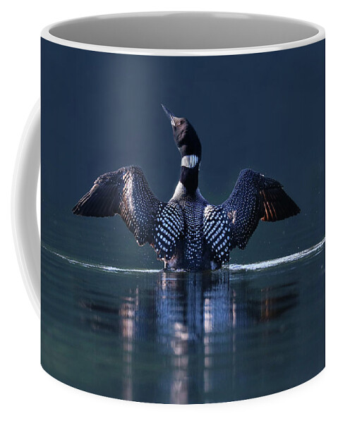 Common Loon Coffee Mug featuring the photograph The Beauty and Strength of a Common Loon by Sandra Huston