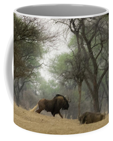 Africa Coffee Mug featuring the photograph The Black Wildebeest by Ernest Echols