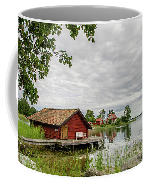 The Old Boat-house Coffee Mug featuring the photograph The old boat-house by Torbjorn Swenelius