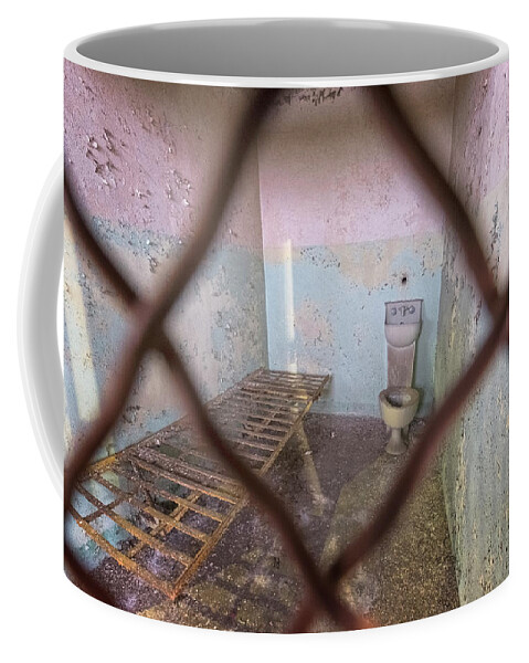 Eastern State Penitentiary Coffee Mug featuring the photograph Through The Fence by Tom Singleton