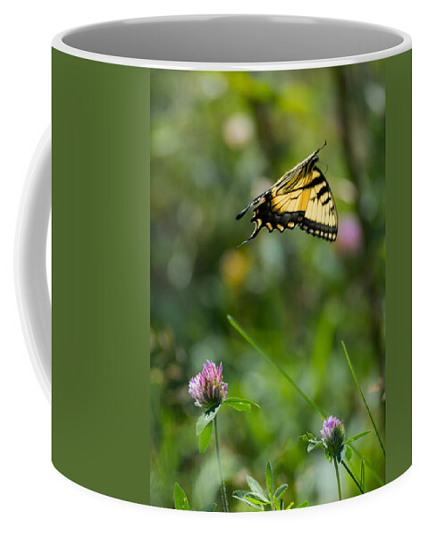Tiger Swallowtail Butterfly In Flight Coffee Mug featuring the photograph Tiger Swallowtail Butterfly In Flight by Holden The Moment