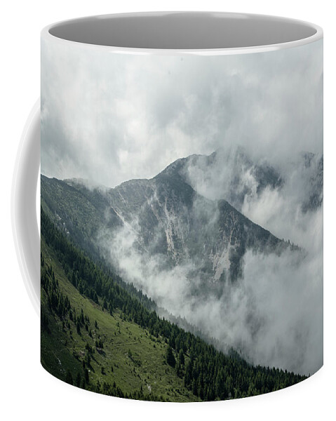 Summit Coffee Mug featuring the photograph Top of a Mountain covered with fog by Nicola Aristolao