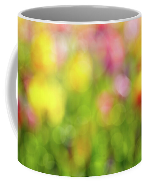 Tulip Coffee Mug featuring the photograph Tulip Flowers Field Blurred Defocused Background by David Gn