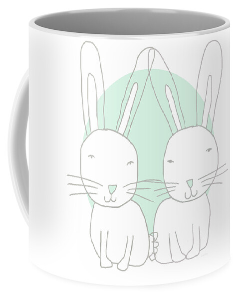 Bunny Coffee Mug featuring the mixed media Two Bunnies- Art by Linda Woods by Linda Woods
