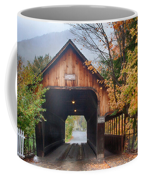 Woodstock Middle Bridge Coffee Mug featuring the photograph Vermont fall colors over the middle bridge by Jeff Folger